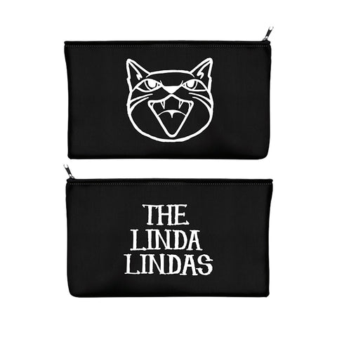 Two black zippered pouches by The Linda Lindas: one is a pencil case with a white, stylized open-mouthed cat face, and the other features THE LINDA LINDAS printed in bold white letters.