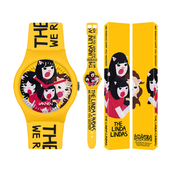 A limited edition The Linda Lindas yellow Vannen wristwatch with cartoon band illustrations, bold black text, and playful designs on the face and box. Powered by precise Japanese Quartz movement.