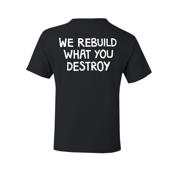 Printed on durable Gildan Heavy Cotton, this black youth T-shirt by The Linda Lindas features bold white text on the back: WE REBUILD WHAT YOU DESTROY.