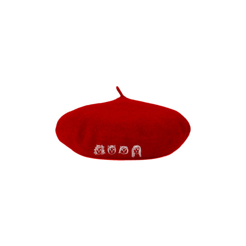 Image of a red beret hat against a white background. The hat features drawings of 4 different cat faces in white- three have shorter hair and one has longer hair. Below this in white text reads "the linda lindas". The cat faces are embroidered.