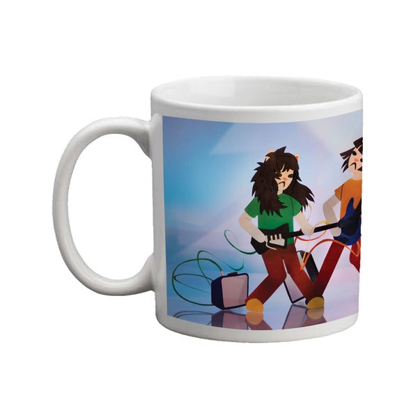 Image of a white mug against a white background. The center of the mug features the Linda Lindas- Growing up album artwork. This photo displays the left side of the mug-which is the left half of the artwork. The background is a light and dark teal color with white mixed in. Two cat cartoon graphics are playing instruments with an amp on the ground.