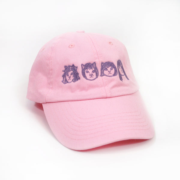 image of the front of a pink dad hat on a white background. front of the hat has the linda linda members as cats embroidered in purple across the front