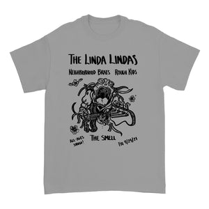 Image of the front of a silver grey colored tshirt against a white background. Across the chest in black text reads "the linda lindas". Below that reads neighborhood brats, rough kits. Below this is a graphic of a monster playing guitar. There are a few flowers around the graphic. This is also in black. Below this in black text reads "all-ages show! The Smell. Fri 9/24/21.
