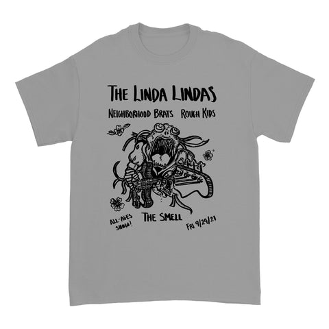 Image of the front of a silver grey colored tshirt against a white background. Across the chest in black text reads "the linda lindas". Below that reads neighborhood brats, rough kits. Below this is a graphic of a monster playing guitar. There are a few flowers around the graphic. This is also in black. Below this in black text reads "all-ages show! The Smell. Fri 9/24/21.