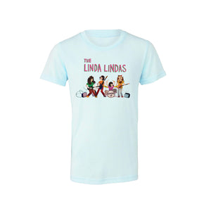 Image of an ice blue tshirt against a white background. In a red/pink text with a green outline reads "the linda lindas". Below that is an image of 4 colorful cartoon characters representing the linda lindas playing guitar, bass, and drums. in black text, The bass drum says growing up.